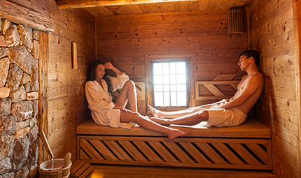 a couple enjoying a sauna 